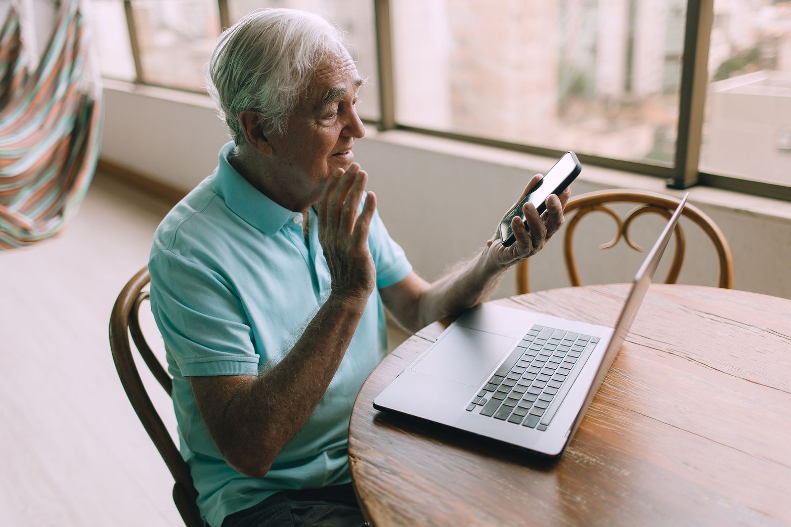 Older veteran screening a suspicious phone call, a common vector for VA benefits scams targeting veterans