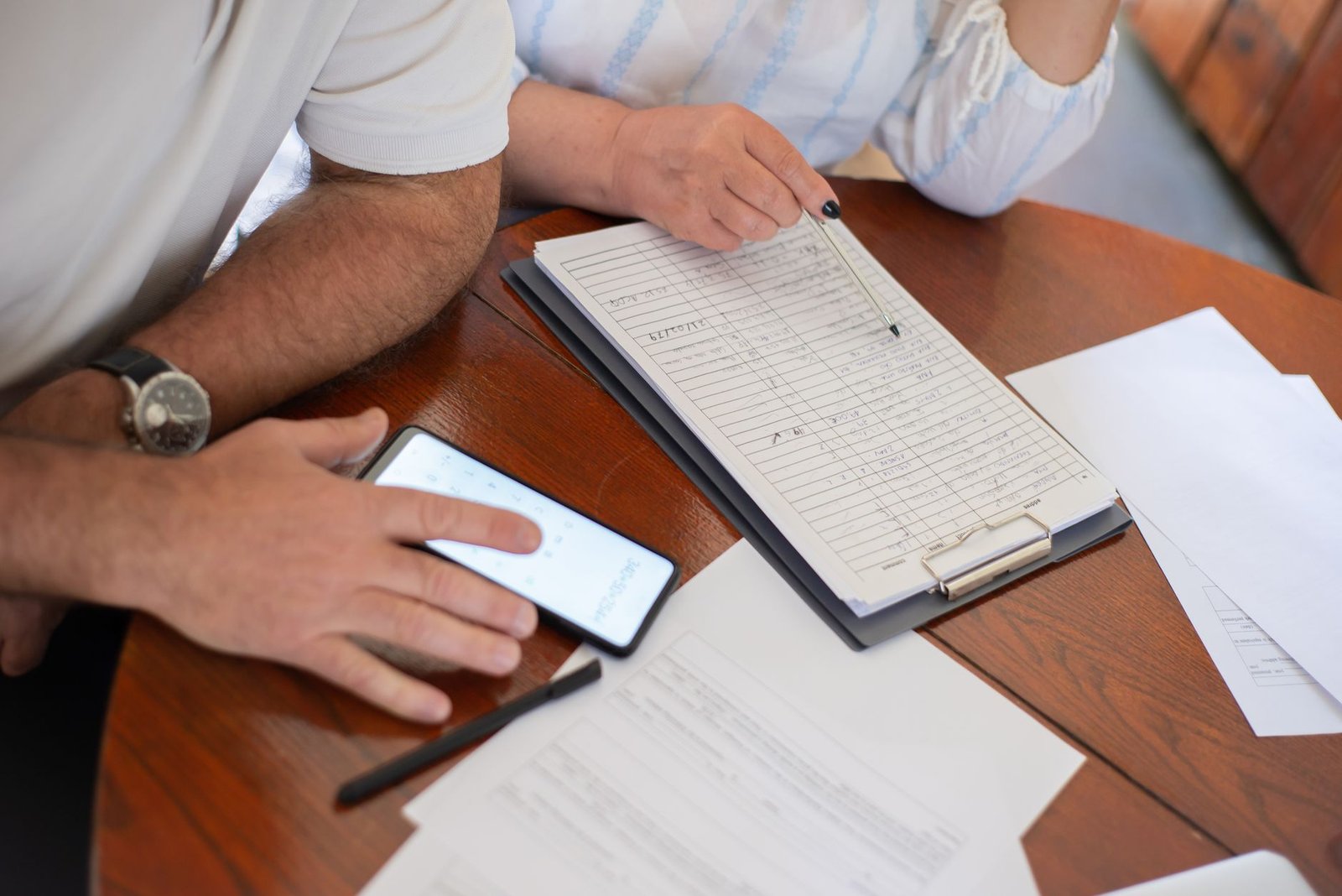 Older veteran calculating finances while navigating disability benefits after divorce