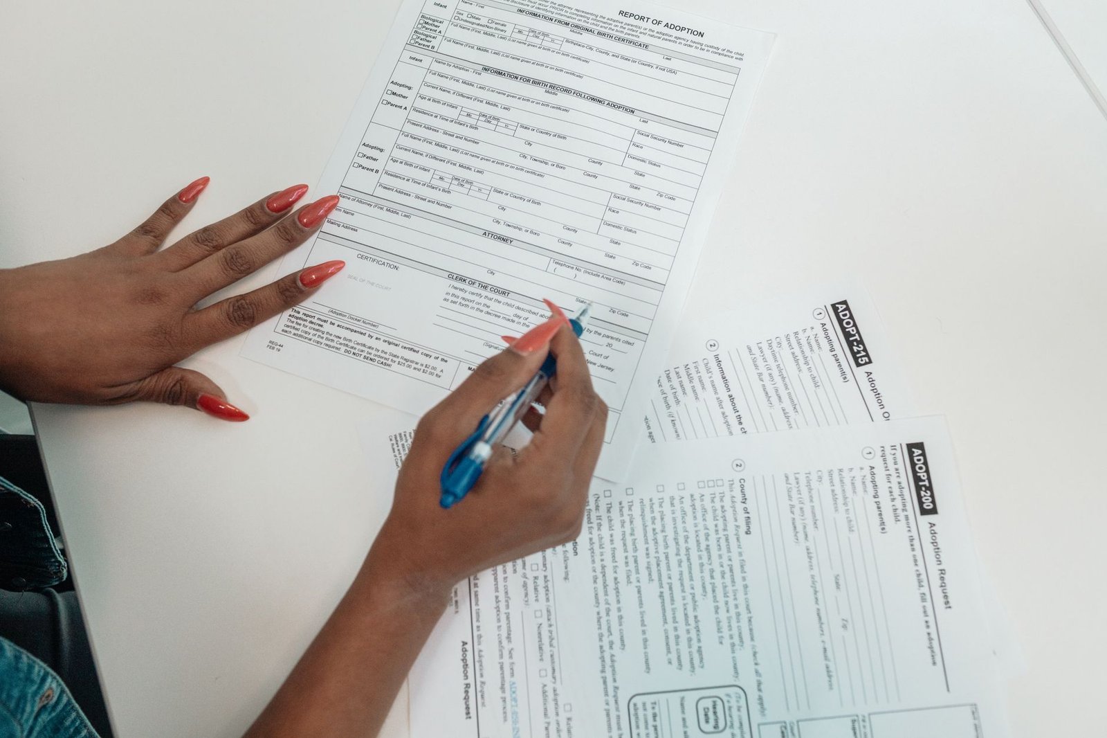 Hands completing a checklist of forms for transferring VA benefits during an out-of-state move