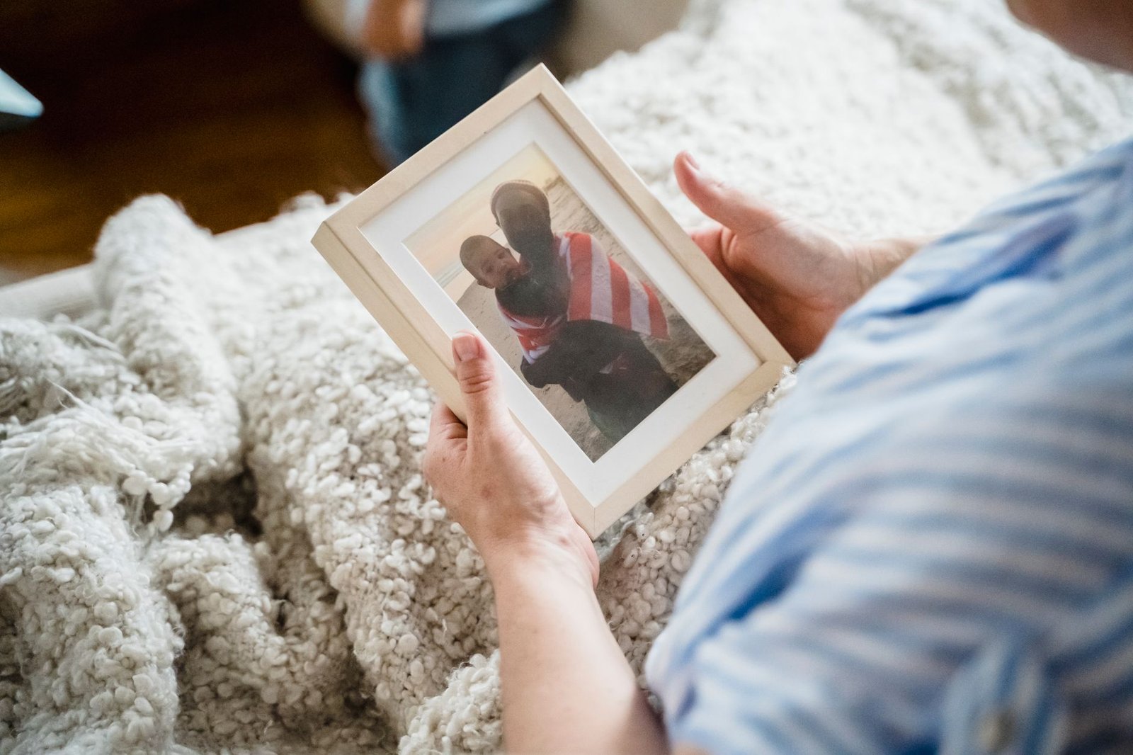 American flag and framed service photo in the home of a family eligible for Camp Lejeune water contamination VA benefits