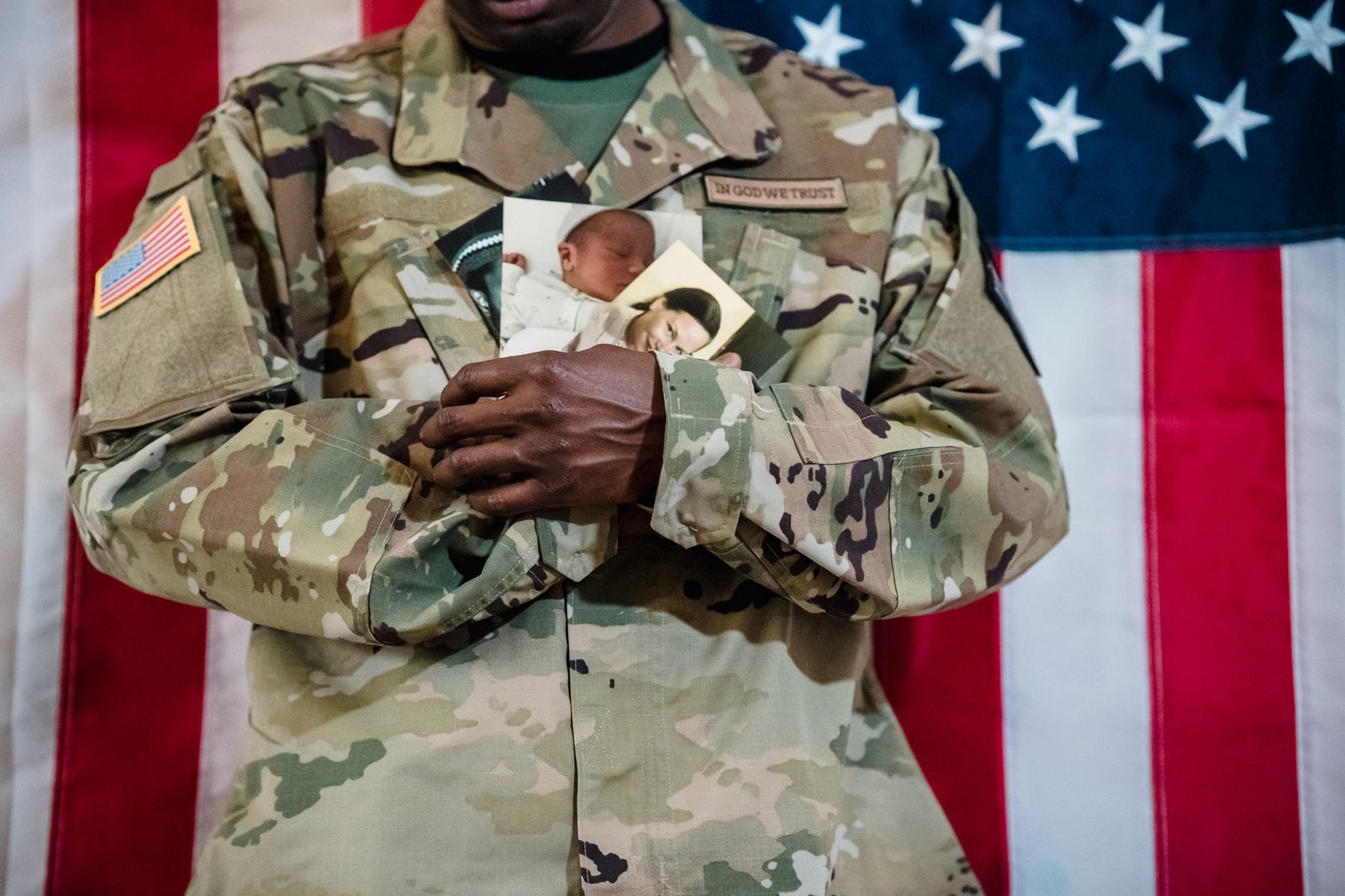 Framed service photo and American flag in the home of a veteran filing an Agent Orange exposure VA claim