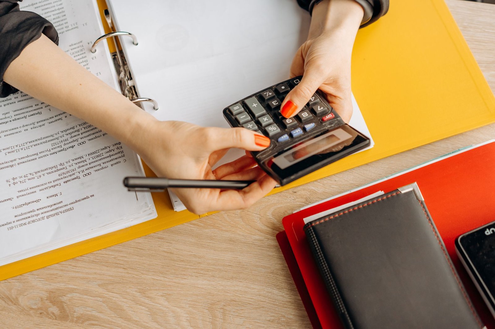 Hands sorting paperwork while reviewing VA disability garnishment and child support obligations
